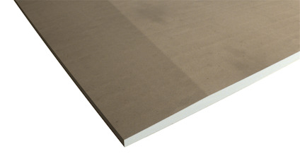 Brun gipsskiva med vita kanter mot svart bakgrund, visar ett hörn av en fyrkantig skiva.