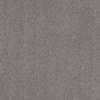Gråmelerad yta med små fläckar i olika nyanser, vilket ger en texturerad, stenliknande utseende.