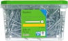 Transparent plastlåda med grönt lock innehållande 250 gipsskruvar, märkt "Gipsskruv 3,9 x 41".